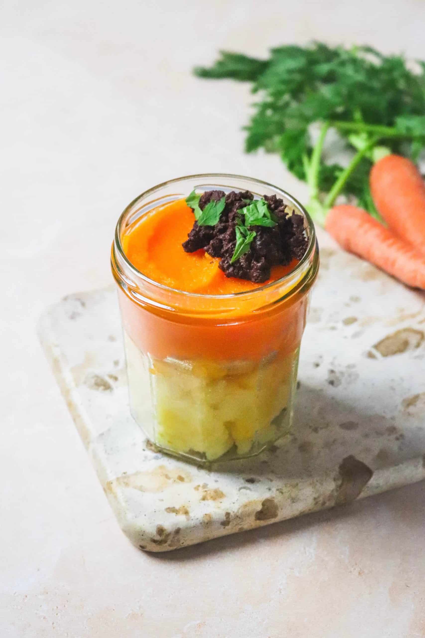 Écrasé de pommes de terre et purée de carottes au boudin noir